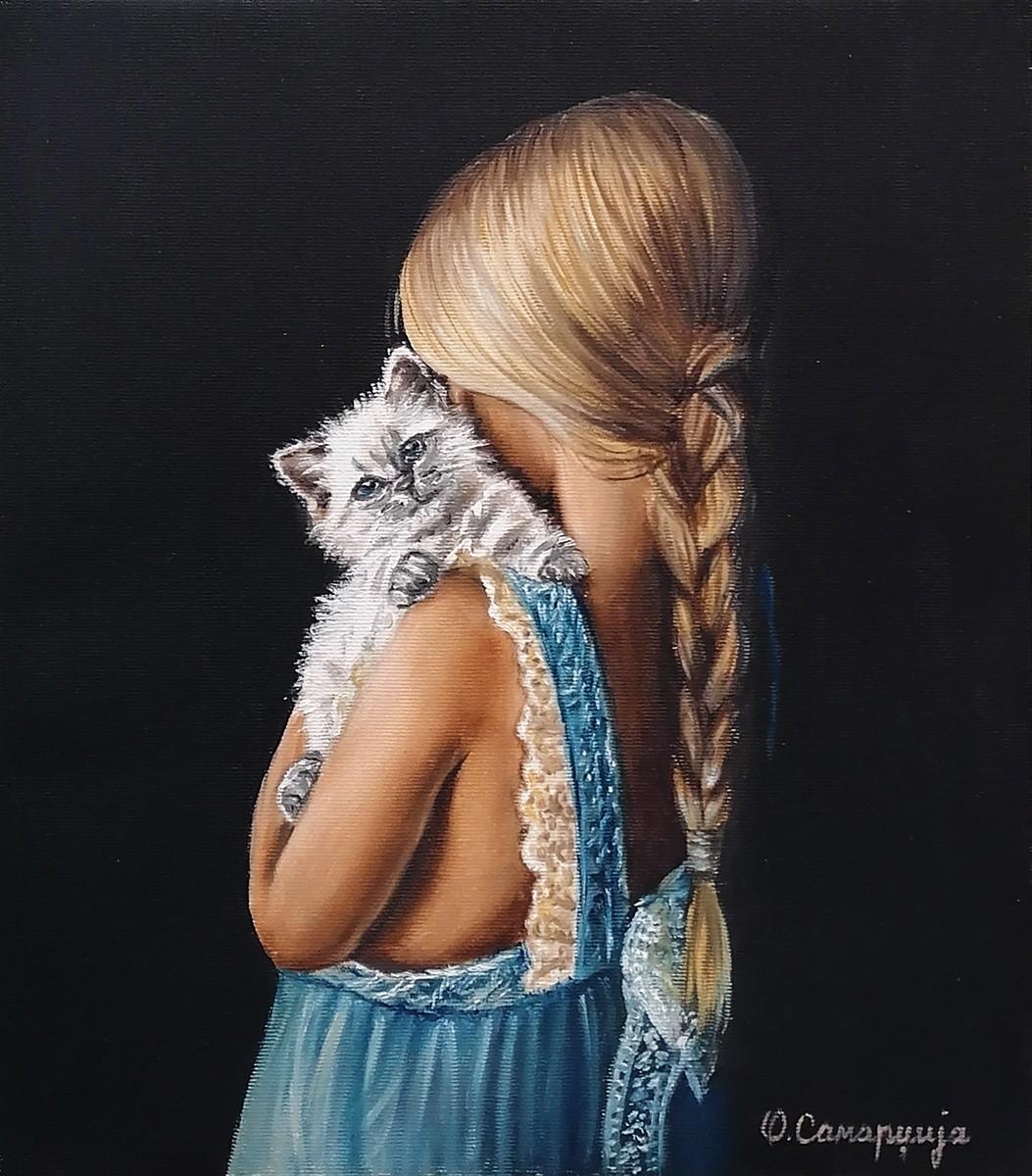 Little girl with a kitten