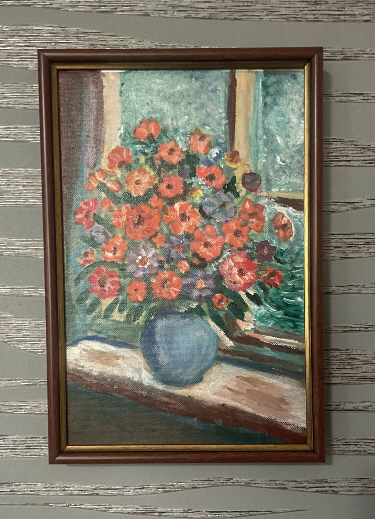 Red flowers by the window